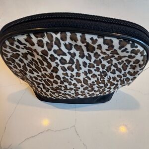 Lancôme pull zipper Leopard Print Cosmetic Bag. Lined inside with plastic